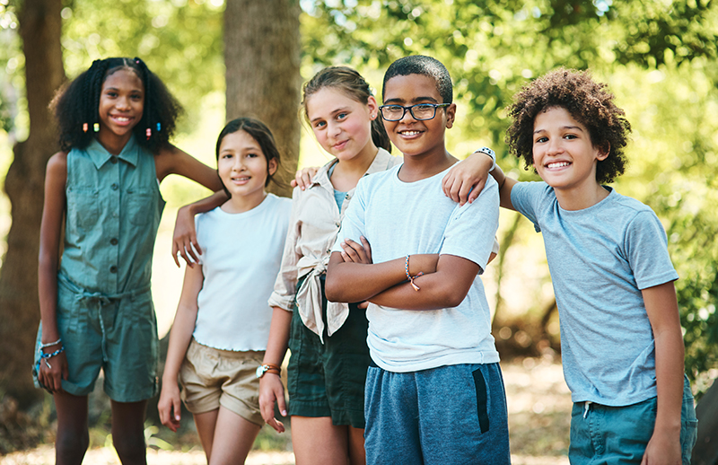 Shot of a group of teenagers having fun at summer camp.